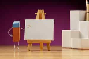 Free photo eraser painting on easel still life