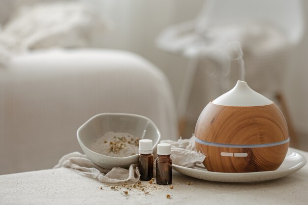 Essential oil aroma diffuser humidifier diffusing water articles in the air.