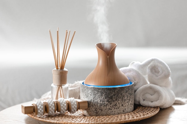 Free photo essential oil aroma diffuser humidifier diffusing water articles in the air