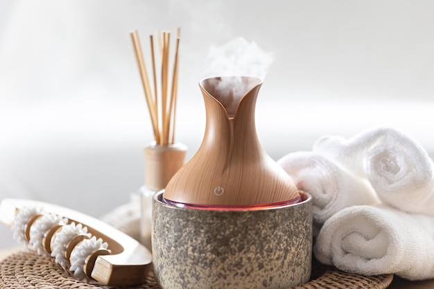 Free photo essential oil aroma diffuser humidifier diffusing water articles in the air