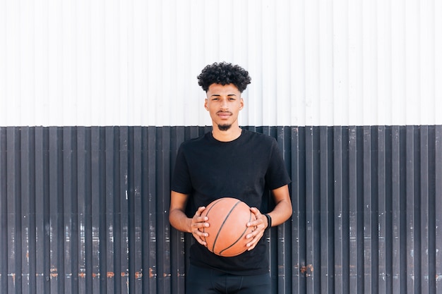 Free Photo ethnic male with basketball ball