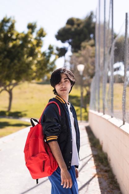 Ethnic pupil after school in park