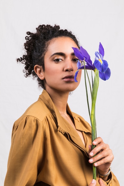 Ethnic romantic woman with blue flower 