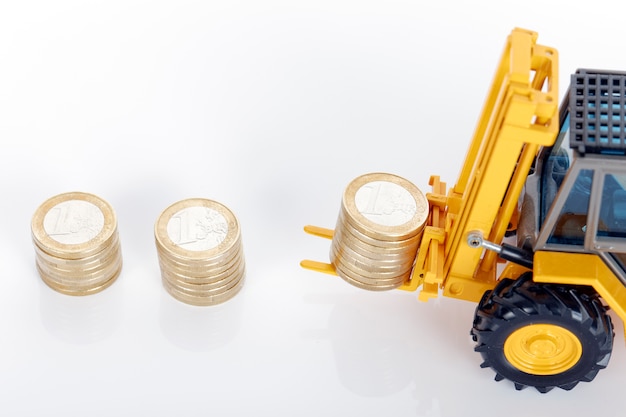 Free photo euro money coins and forklift on white space