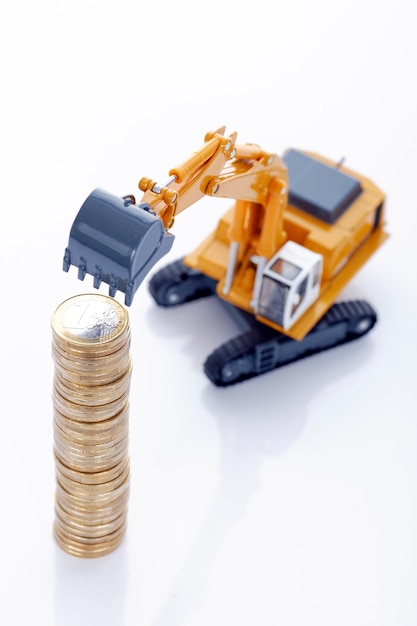 Free photo euro money coins with excavator on white