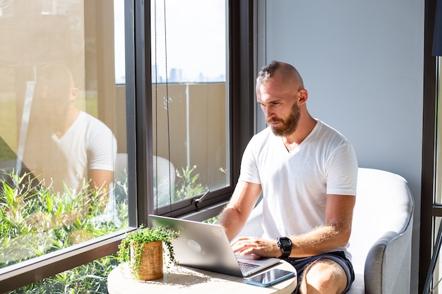 Free Photo european business man in white shirt does distance work