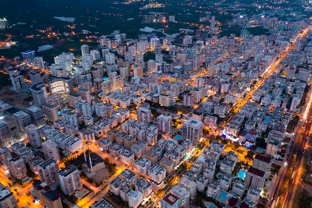 Evening agglomerated city life lightened by city traffic in Turkey