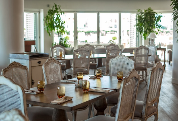 Event hall wooden table with rustic chairs