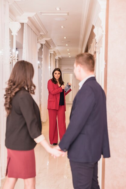 Event manager and couple talking 