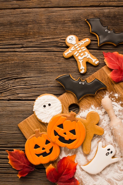 Free Photo evil halloween cookies on a wooden background