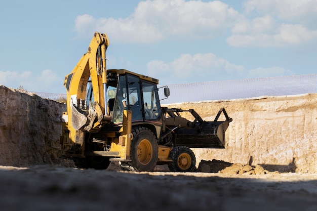 Excavator digging in the ground on day light