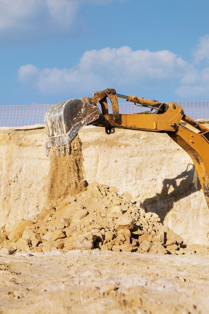 Excavator digging in the ground on day light