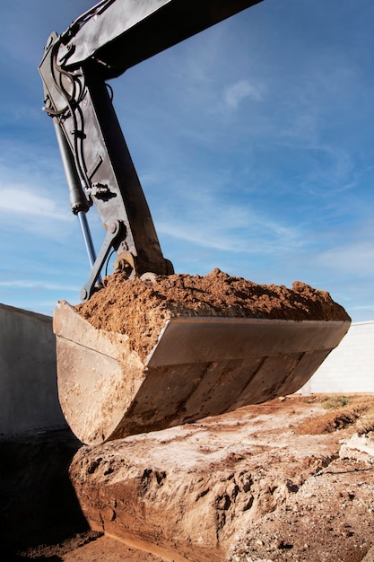 Excavator digging in the ground on day light