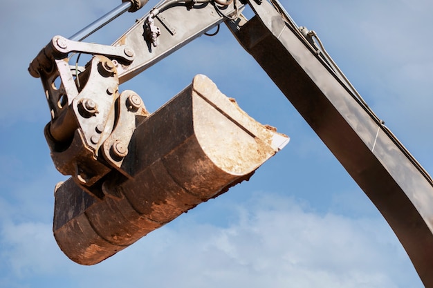 Excavator digging in the ground on day light