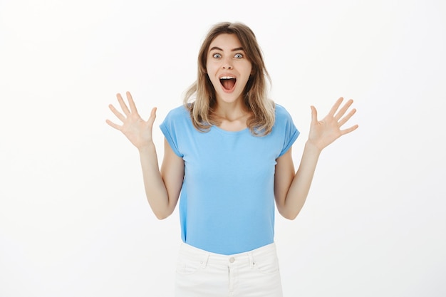 Free Photo excited beautiful blond woman telling great news, rejoicing and celebrating