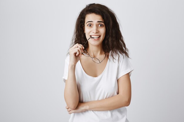 Excited and enthusiastic girl looking with amazement