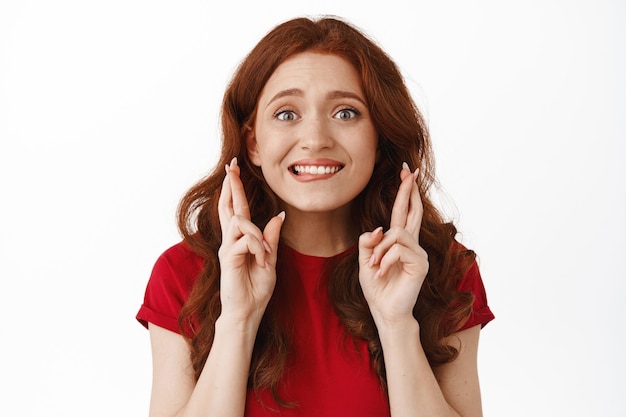 Free photo excited and hopeful redhead woman