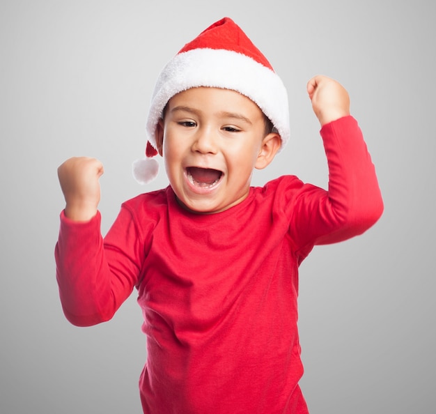 Excited kid raising his fists