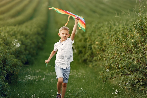 Excited little boy running with a toy plane