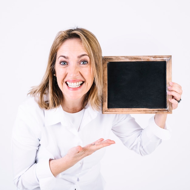 Excited woman demonstrating chalkboard