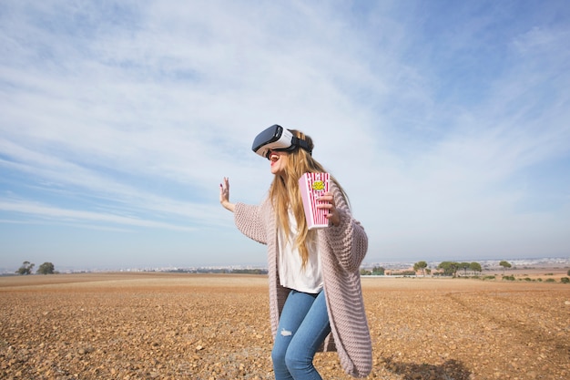 Free Photo excited woman in goggles enjoying movie