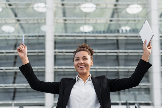 Free Photo excited woman with arms up