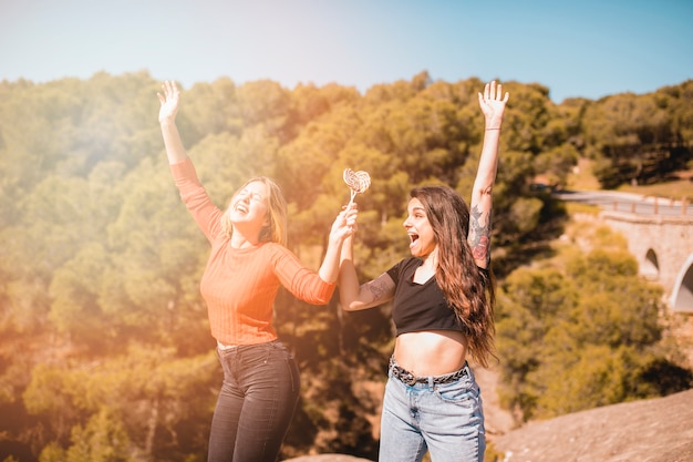 Free Photo excited women with lollipops