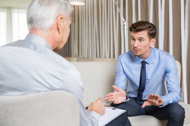 Excited Young and Senior Businessman Negotiating