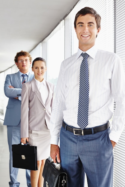 Executive smiling with briefcase