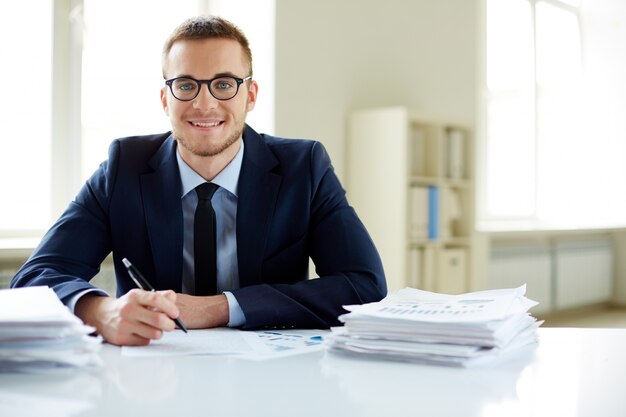 Executive with glasses working in the office