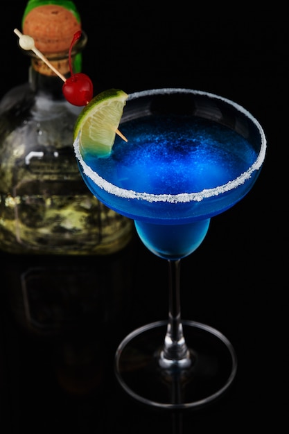 Exotic cocktail with lime and cherry