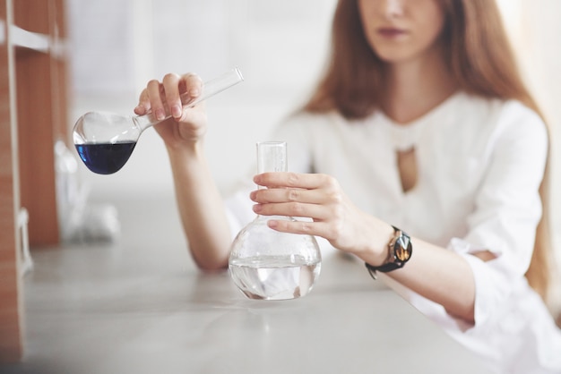 Experiments in the chemical laboratory. An experiment was carried out in a laboratory in transparent flasks.