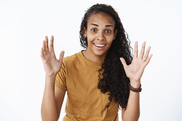 Expressive African-American girl in brown Tshirt