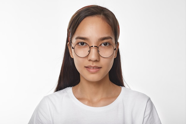 Expressive Asian girl posing indoor