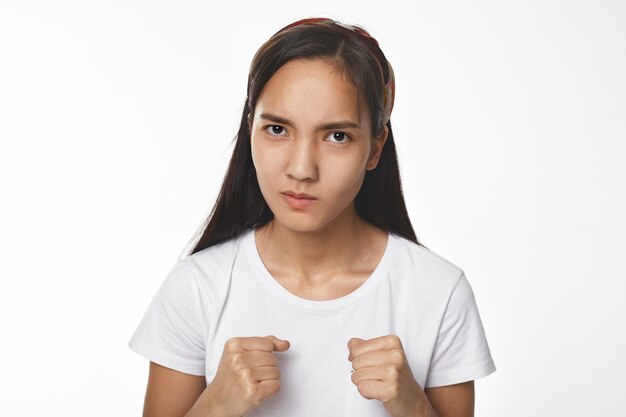 Expressive Asian girl posing indoor