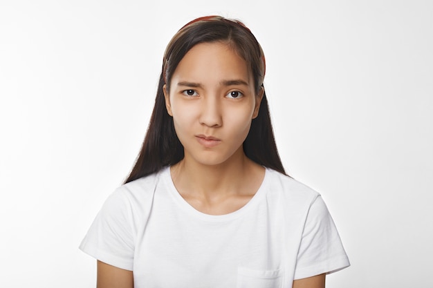 Expressive Asian girl posing indoor