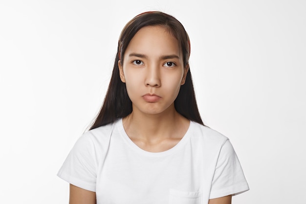 Expressive Asian girl posing indoor