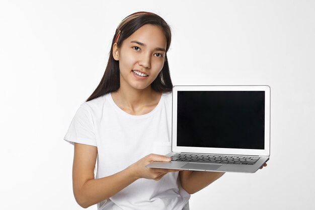 Expressive Asian girl posing indoor