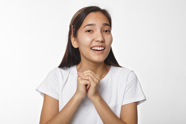 Expressive Asian girl posing indoor