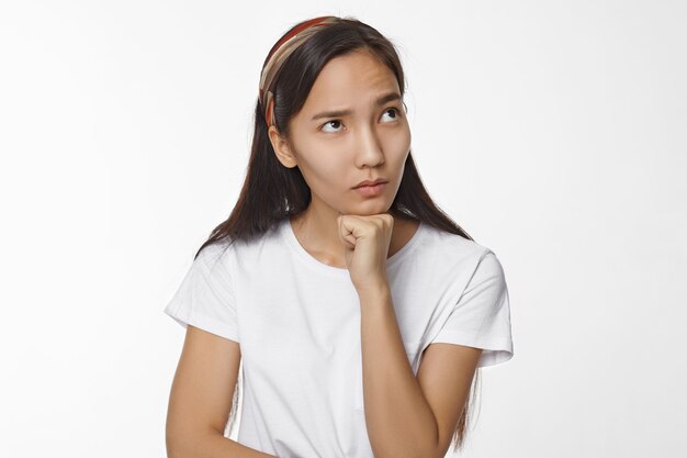 Expressive Asian girl posing indoor