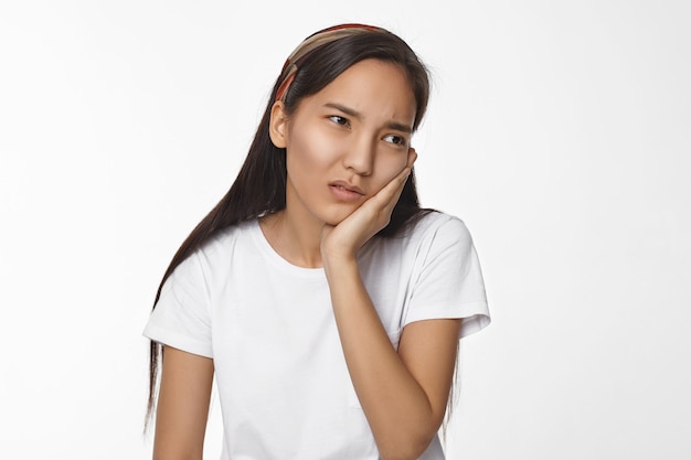 Expressive Asian girl posing indoor