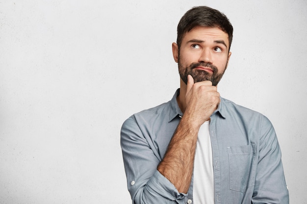 Expressive bearded man wearing shirt