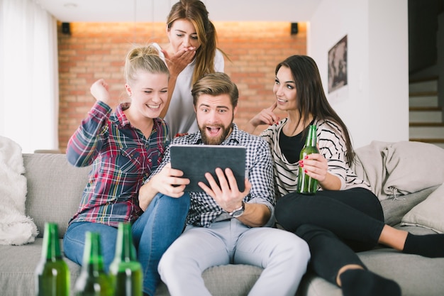 Expressive friends grimacing for selfie having party