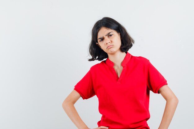 An expressive girl is posing in the studio