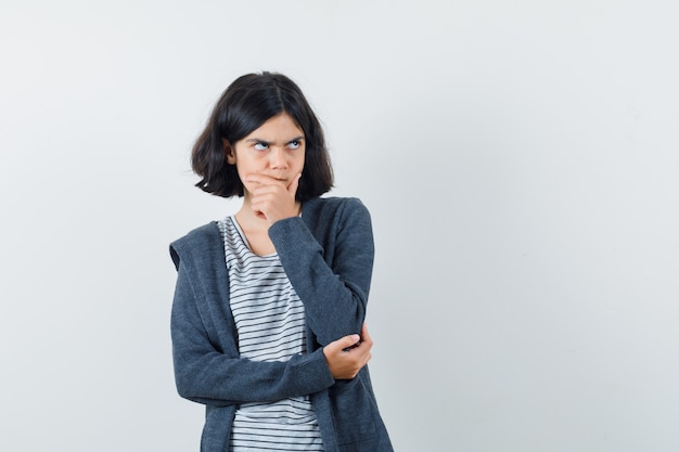 An expressive girl is posing in the studio