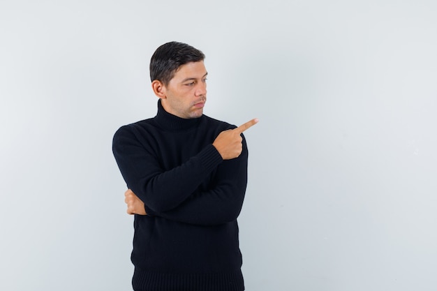 An expressive man is posing in the studio