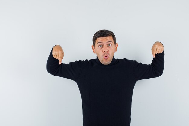 An expressive man is posing in the studio