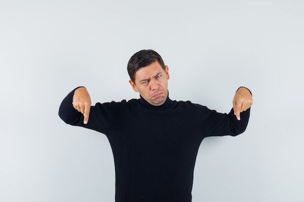 An expressive man is posing in the studio