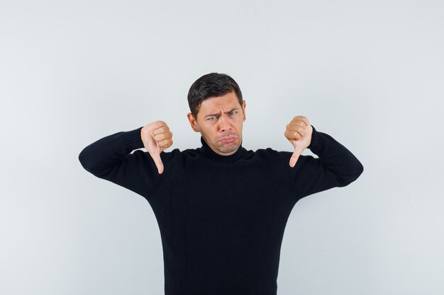 An expressive man is posing in the studio