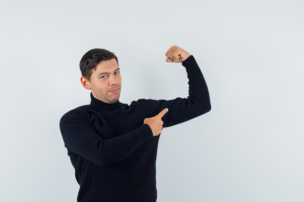 An expressive man is posing in the studio